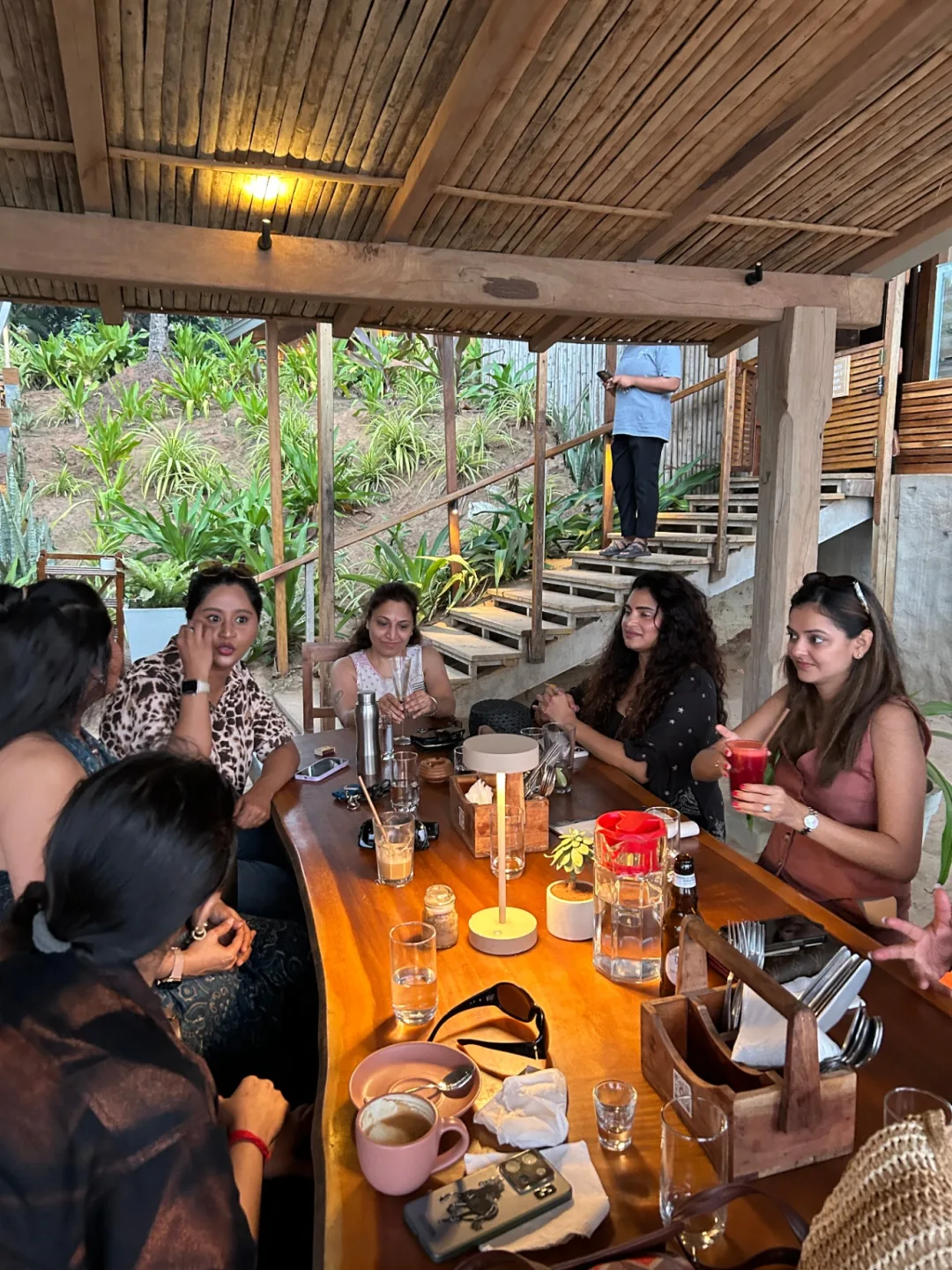 An intentional circle of women gathered around a table