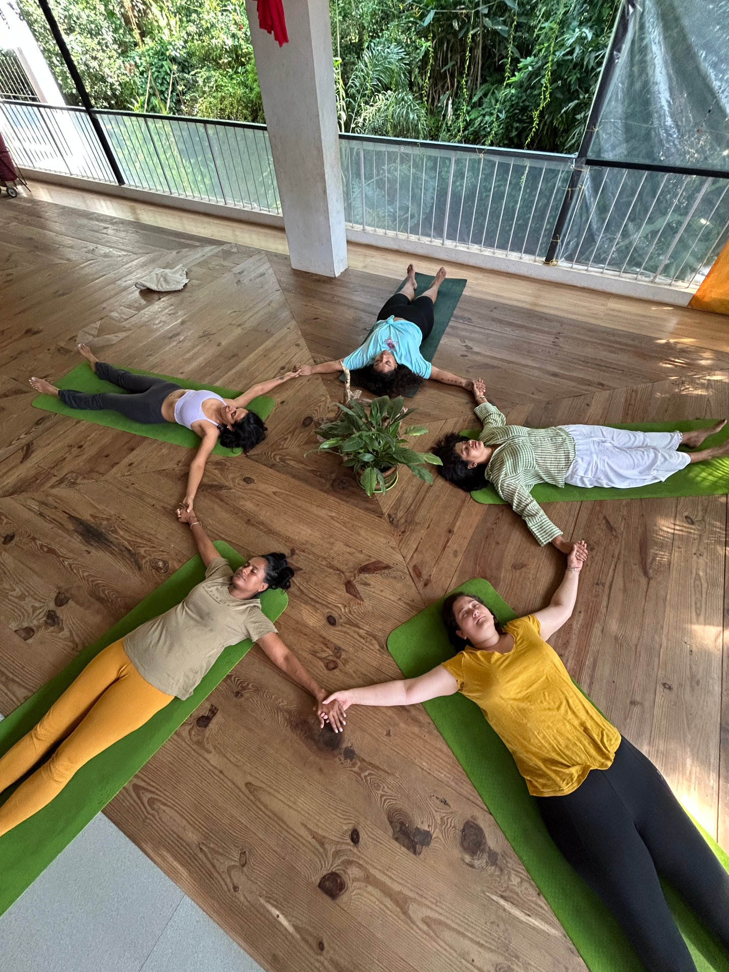Women in savasana circle